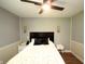 Comfortable bedroom featuring a ceiling fan, queen bed, with a modern style at 15203 Shoreway Ct, Carmel, IN 46032