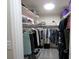 Walk-in closet with organized shelving, hanging space, and overhead lighting at 15203 Shoreway Ct, Carmel, IN 46032