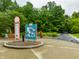 Photograph of an informational sign at a local park surrounded by lush trees and greenery at 15203 Shoreway Ct, Carmel, IN 46032