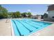 Large swimming pool with marked lanes for exercise, offering a cool retreat on sunny days at 15203 Shoreway Ct, Carmel, IN 46032