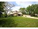 Two-story home with an attached garage and spacious driveway, complemented by a well-maintained lawn at 15203 Shoreway Ct, Carmel, IN 46032