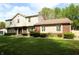 Charming two-story home with a brick and siding facade, complemented by a well-manicured lawn at 15203 Shoreway Ct, Carmel, IN 46032