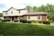 Attractive two-story home showcasing a brick and siding exterior, complemented by a meticulously maintained lawn at 15203 Shoreway Ct, Carmel, IN 46032