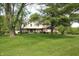Two-story home with well-maintained lawn and garden and a combination of brick and siding exterior at 15203 Shoreway Ct, Carmel, IN 46032