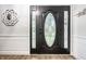 Elegant front door features decorative glass panel and side lights at 15203 Shoreway Ct, Carmel, IN 46032