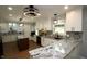 Spacious kitchen with stainless steel appliances, granite countertops, mosaic backsplash and island at 15203 Shoreway Ct, Carmel, IN 46032