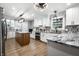 Beautiful kitchen featuring white cabinets, a wood island, and decorative tile backsplash at 15203 Shoreway Ct, Carmel, IN 46032