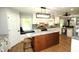 Open concept kitchen with an island, granite countertops, stainless steel appliances and mosaic backsplash at 15203 Shoreway Ct, Carmel, IN 46032