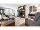 Comfortable living room with gray furnishings, fireplace, and stylish decor at 15203 Shoreway Ct, Carmel, IN 46032