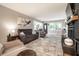 Bright living room featuring a cozy fireplace, gray sofa, and elegant rug at 15203 Shoreway Ct, Carmel, IN 46032
