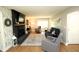 Spacious living room with fireplace, hardwood floors, and ample seating area at 15203 Shoreway Ct, Carmel, IN 46032