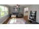 A modern living room featuring a ceiling fan, a large rug, and lots of natural light at 15203 Shoreway Ct, Carmel, IN 46032
