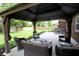Comfortable outdoor seating under a gazebo overlooking a well-manicured yard, ideal for enjoying the outdoors at 15203 Shoreway Ct, Carmel, IN 46032