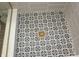 Close up of stylish tile shower floor with intricate pattern and modern drain at 15203 Shoreway Ct, Carmel, IN 46032