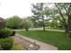 Street view of a well-maintained lawn featuring beautiful and mature trees at 15203 Shoreway Ct, Carmel, IN 46032