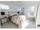 A cozy bedroom with a modern bed, soft carpet, and bright natural light at 1525 Marlowe Ave, Indianapolis, IN 46201