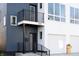 Modern two-story home with a mix of colors and a balcony overlooking the front yard at 1525 Marlowe Ave, Indianapolis, IN 46201