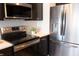 Close-up of modern kitchen appliances, featuring stainless steel refrigerator and stovetop at 1525 Marlowe Ave, Indianapolis, IN 46201