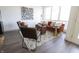 Bright living room with hardwood floors, stylish furniture, and a large window at 1525 Marlowe Ave, Indianapolis, IN 46201