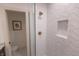 Contemporary shower featuring geometric accent wall and brushed gold fixtures at 1525 Marlowe Ave, Indianapolis, IN 46201