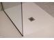 Detail of walk-in shower with drain and patterned tile at 1525 Marlowe Ave, Indianapolis, IN 46201