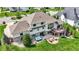 Aerial view of a beautiful home with a hot tub, deck, patio seating, and lush green lawn at 16731 George Gang Blvd, Westfield, IN 46062