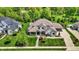 Aerial view of an elegant home featuring lush landscaping, a manicured lawn, and a welcoming entrance at 16731 George Gang Blvd, Westfield, IN 46062