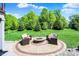Backyard patio features a cozy seating area with a fire pit, ideal for enjoying outdoor gatherings at 16731 George Gang Blvd, Westfield, IN 46062