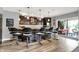 Modern bar features sleek countertops, a beverage cooler, stylish lighting, and seating for entertaining guests at 16731 George Gang Blvd, Westfield, IN 46062