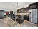 Modern bar area features sleek countertops, a beverage cooler, stylish lighting, and seating for entertaining at 16731 George Gang Blvd, Westfield, IN 46062