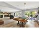 Finished basement featuring pool table, bar, dining table, and entertainment area at 16731 George Gang Blvd, Westfield, IN 46062