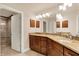 Spacious bathroom with double granite vanity, tile flooring, and a glass-door shower in neutral, modern tones at 16731 George Gang Blvd, Westfield, IN 46062