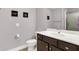 Bathroom features white sink and toilet with neutral-colored walls and modern lighting at 16731 George Gang Blvd, Westfield, IN 46062