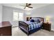 Cozy bedroom with a comfortable bed, a ceiling fan, and ample natural light from the window at 16731 George Gang Blvd, Westfield, IN 46062