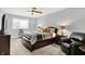 Cozy bedroom features a comfortable queen-sized bed, soft lighting, and a ceiling fan for a relaxing atmosphere at 16731 George Gang Blvd, Westfield, IN 46062
