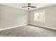 Neutral bedroom features carpeting, large window, and ceiling fan at 16731 George Gang Blvd, Westfield, IN 46062