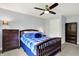 Comfortable bedroom with ceiling fan, window for natural light, and classic furnishings at 16731 George Gang Blvd, Westfield, IN 46062
