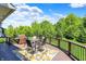 Outdoor deck with a grill, dining table, and a colorful rug, offering a perfect spot for outdoor dining at 16731 George Gang Blvd, Westfield, IN 46062