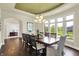 Bright dining room featuring hardwood floors, large windows, and stylish chandelier at 16731 George Gang Blvd, Westfield, IN 46062