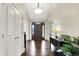 Inviting foyer with hardwood floors, modern lighting, and a view into the home at 16731 George Gang Blvd, Westfield, IN 46062