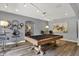 Basement game room featuring pool table, lounge area, and modern lighting at 16731 George Gang Blvd, Westfield, IN 46062