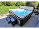 Luxurious hot tub with steps and a side table, set on a concrete patio near the home at 16731 George Gang Blvd, Westfield, IN 46062