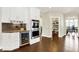 Modern kitchen featuring stainless steel appliances, granite countertops, and a spacious walk-in pantry at 16731 George Gang Blvd, Westfield, IN 46062