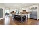 Open-concept kitchen featuring a large island, modern lighting, and stainless steel appliances at 16731 George Gang Blvd, Westfield, IN 46062