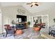 Cozy living room featuring a fireplace, entertainment center, and comfortable seating arrangements at 16731 George Gang Blvd, Westfield, IN 46062