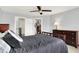 Bedroom featuring neutral walls, ceiling fan, and natural light next to a walk-in closet at 16731 George Gang Blvd, Westfield, IN 46062