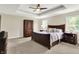 Serene main bedroom featuring tray ceiling, neutral decor, and ample natural light at 16731 George Gang Blvd, Westfield, IN 46062