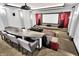 Home theater room with tiered seating, projector, screen, and comfortable seating for an immersive viewing experience at 16731 George Gang Blvd, Westfield, IN 46062