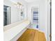 Bathroom with long vanity, well-lit mirror, and a separate toilet and shower area at 1813 Kingsley Dr, Anderson, IN 46011