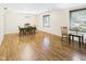 Dining room with chandelier, wood floors, and large window at 1813 Kingsley Dr, Anderson, IN 46011